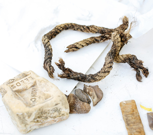 A range of materials are shown such as a piece of string, a soap which has Leeds embossed into it and few stones