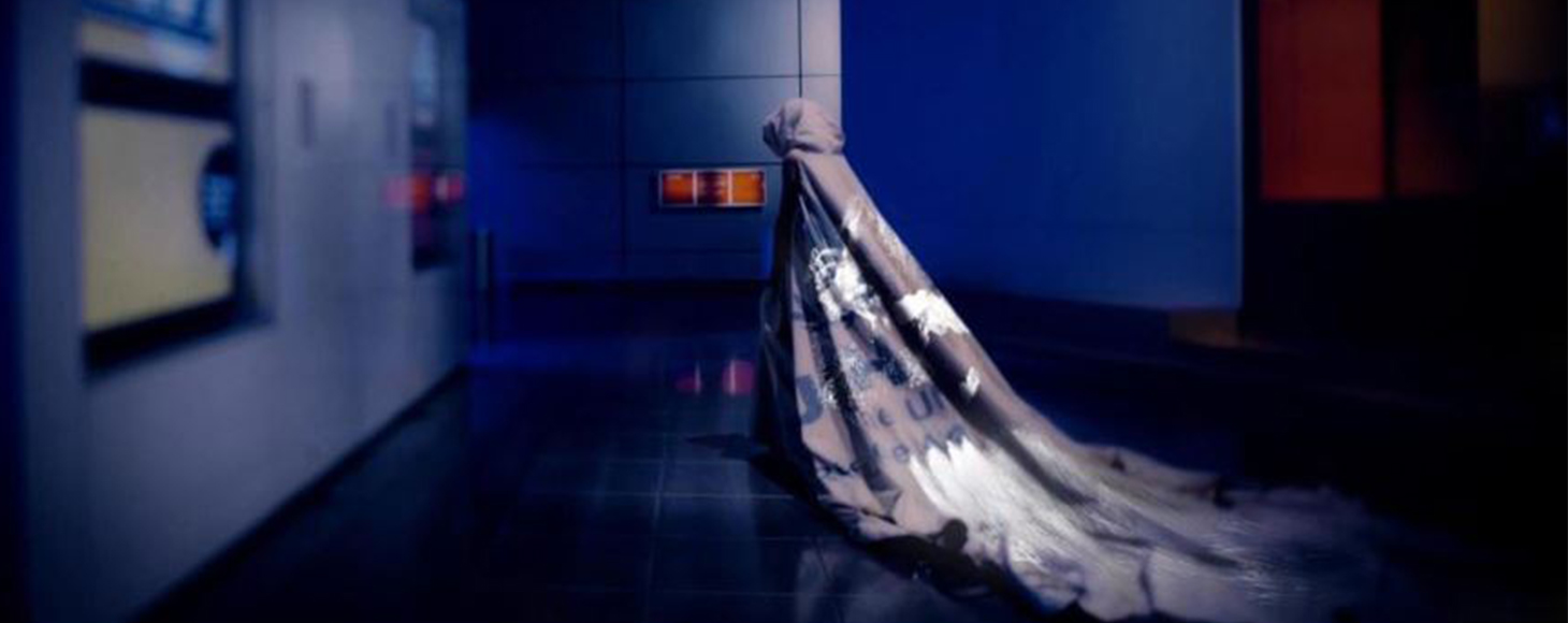 A model walks wearing a dress designed by Helen Storey, the installation showcase the data visulaisation