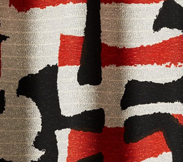 Woven fabric with red and black pattern